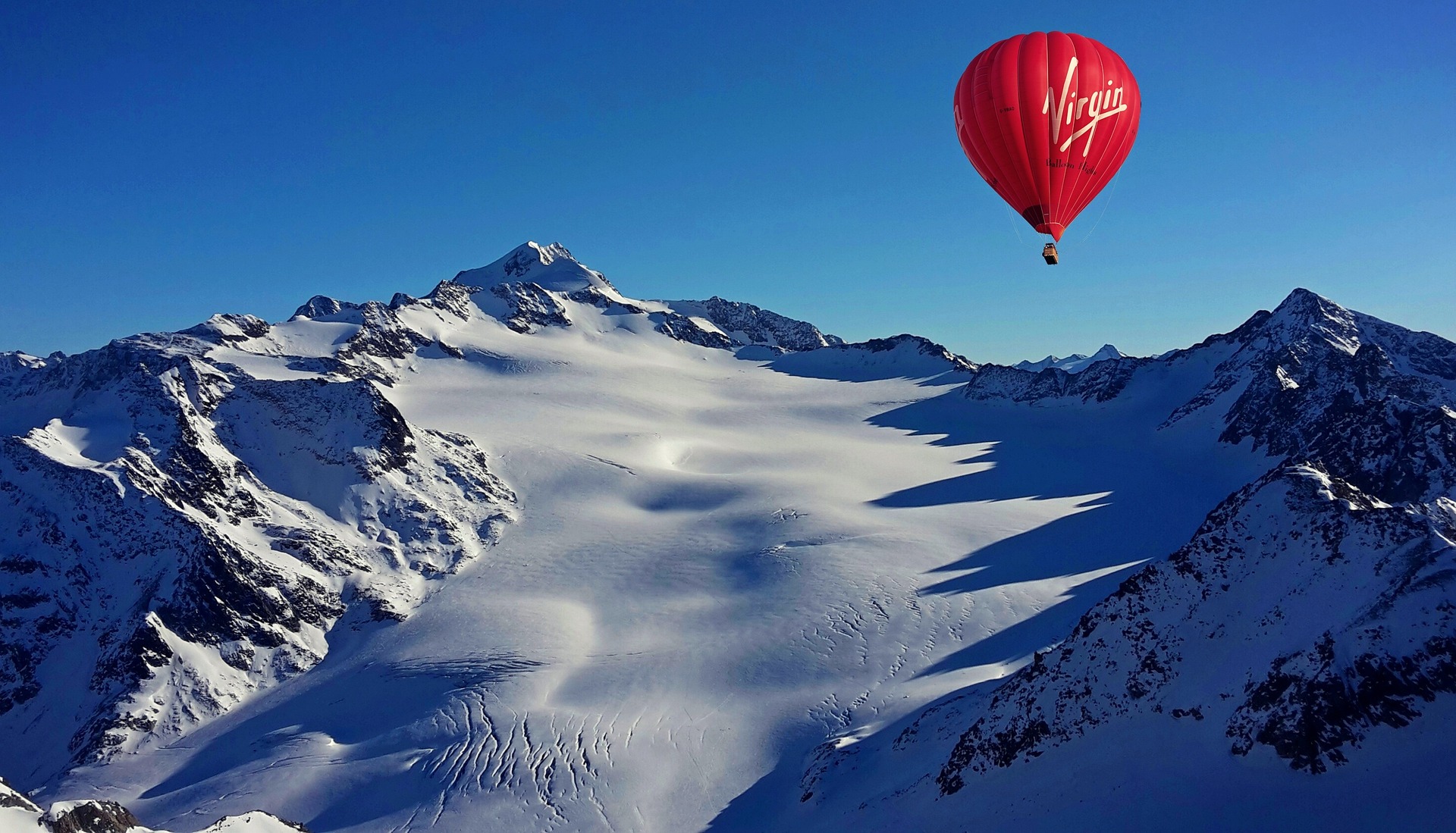 hot air balloon in the swiss mountains